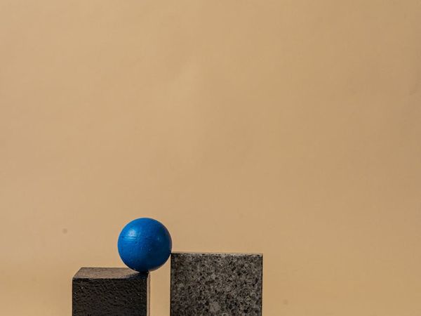 Abstract composition of balanced stones with neon glow