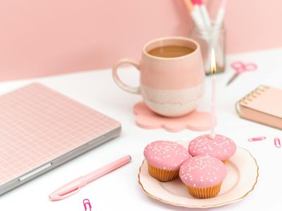 Minimalist office setup with warm pink lighting